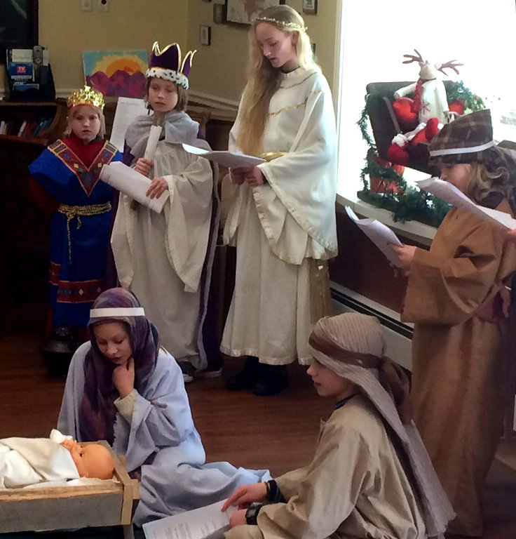 Youth from Trinity Church, Shelburne tell the Christmas story at the Arbors.